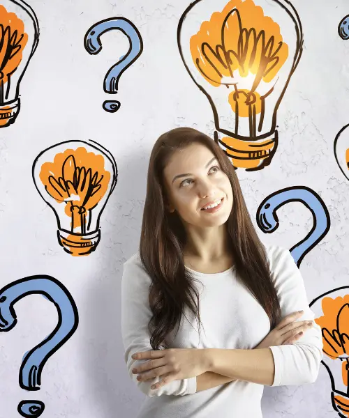 TubLease Hot Tub Rental and Sales 21 A woman with long brown hair stands smiling with arms folded in front of a wall decorated with drawn light bulbs and question marks, suggesting she has an idea for hot tub repair or is thinking creatively about service solutions.