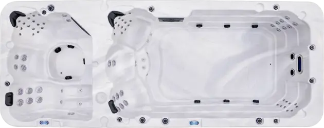 A top-down view of a large white swim spa with built-in seating, multiple jets, and two distinct sections: one for swimming and another for relaxing with massage jets, perfect for wellness enthusiasts in Abu Dhabi.