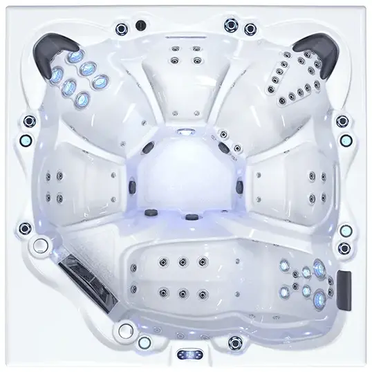 Top-down view of the Avelo, a modern white hot tub with multiple seats, built-in headrests, jet nozzles, and control panels. Its symmetrical design is inspired by Dubai’s luxury trends—perfect for relaxing with friends.